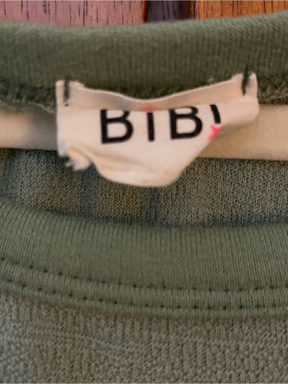 🦀BiBi Sage Green Pullover Top w/Decorative Black Stitching & Front Notched Hem - Picture 2 of 8